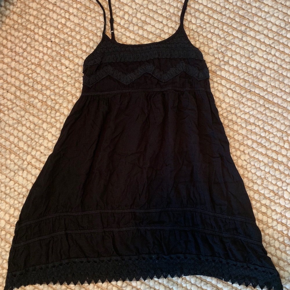 short black dress with lace detail.